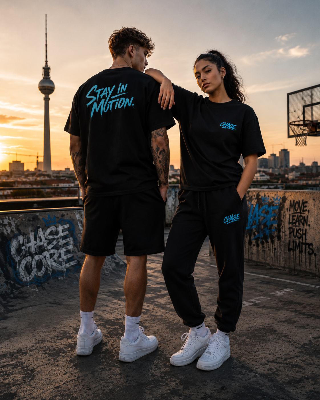 Two models wearing CHASE Core streetwear on an urban rooftop at sunset